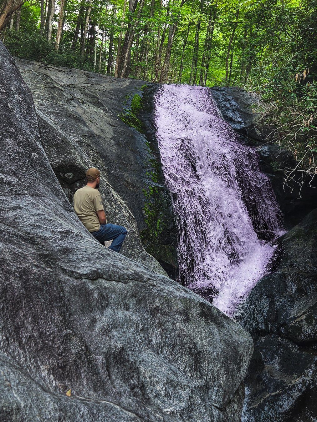 An outdoorsman overlooking a mountain lake
